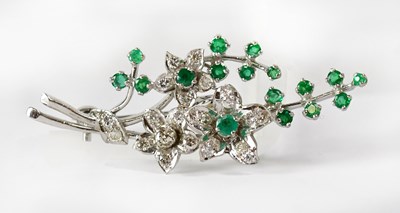 Lot 842 - A white metal brooch in the form of a spray of...