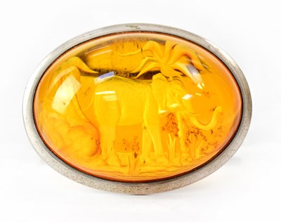 Lot 850 - A white metal brooch set with an amber...