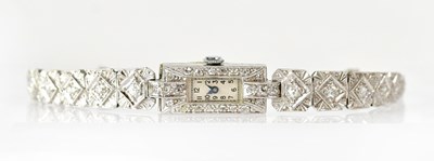Lot 882 - An Art Deco platinum cocktail watch, the...