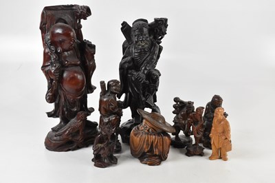 Lot 1356 - Nine Japanese carved hardwood figures, the...