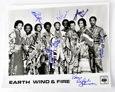 Lot 426 - EARTH, WIND & FIRE; a black and white...