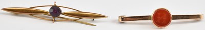 Lot 1374 - Two 9ct gold bar brooches, one with a bezel...