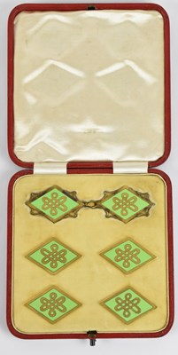 Lot 1061 - A cased set of six gilt metal and green...