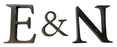 Lot 331 - E & N; a set of three modern cast metal letters.