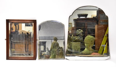 Lot 121 - Two vintage shaped bevelled glass mirrors with...