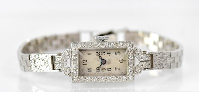 Lot 887 - An Art Deco white metal cocktail watch with...