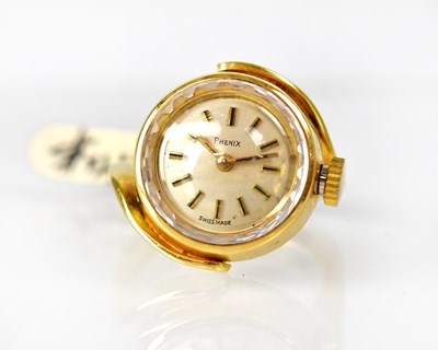 Lot 880 - PHENIX; a Swiss 14ct gold watch ring, the...