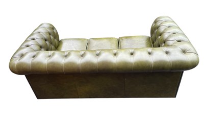 Lot 30 - A green leather three seater Chesterfield sofa,...