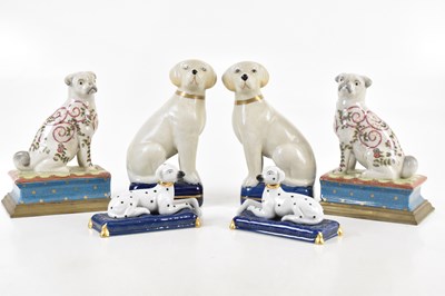 Lot 1567 - A pair of modern pugs mounted as book ends,...