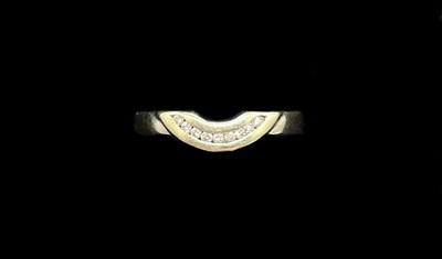 Lot 1273 - An 18ct white gold and diamond channel set...