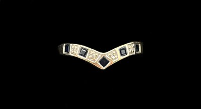 Lot 1277 - A white metal sapphire and diamond wishbone...