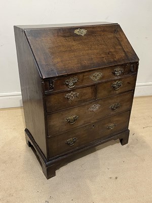 Lot 1044 - An 18th century oak bureau, the fall front...