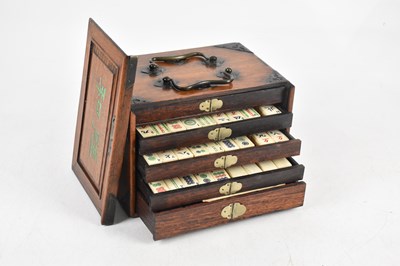 Lot 1406 - A Chinese metal bound mahjong set, with five...
