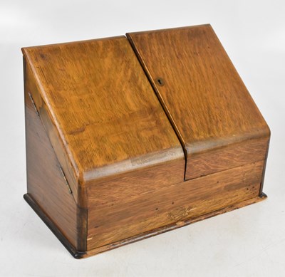 Lot 1407 - An early 20th century oak stationary cabinet,...