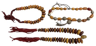 Lot 1508 - Two sets of amber coloured resin beads and a...