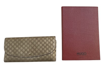 Lot 477 - GUCCI; a lady's GG monogram leather purse, 20...