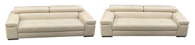 Lot 92 - NATUZZI; a pair of modern cream leather...