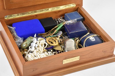 Lot 16 - A 9ct gold bar brooch, mounted with a seated...