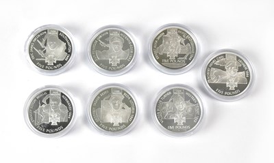 Lot 677 - Seven silver proof commemorative £5 coins...