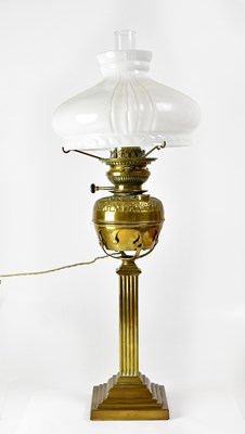 Lot 161 - A brass oil lamp, converted to electricity, on...