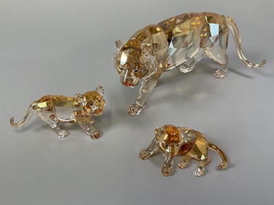 Lot 238 - SWAROVSKI ; a tigress and two cubs with...