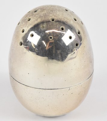 Lot 1217 - A small white metal egg form pepperette,...