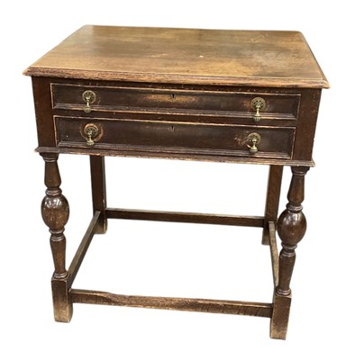 Lot 45 - A 1920s oak two drawer canteen table, with...