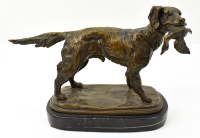 Lot 639 - A bronzed figure of a setter with fowl in its...