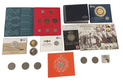 Lot 1572 - An album of limited edition one pound, two...