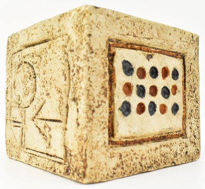 Lot 555 - TROIKA, ENGLAND; a small cube vase decorated...