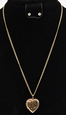 Lot 1464 - A 9ct gold heart shaped locket on a 9ct gold...