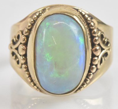 Lot 1234 - A vintage 9ct gold opal ring, the large oval...