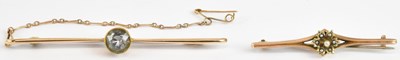 Lot 1364 - Two gold bar brooches comprising a 15ct...