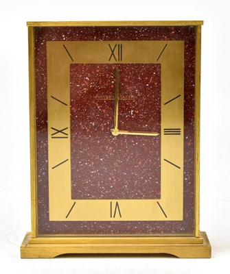 Lot 1483 - JAEGER LECOULTRE; a gilt brass and rouge marble mantel time piece