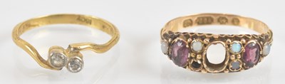 Lot 1337 - An 18ct gold diamond ring with two tiny bezel...