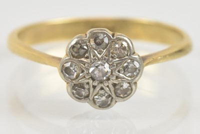 Lot 1338 - An 18ct gold ring with flower head tiny...