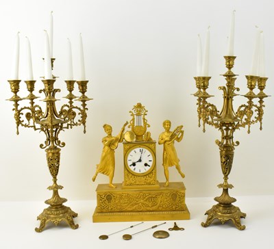 Lot 121 - A 19th century gilt metal clock, the white...