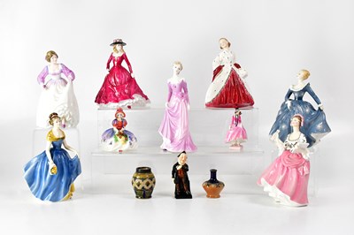 Lot 254 - ROYAL DOULTON; eight figures, comprising...