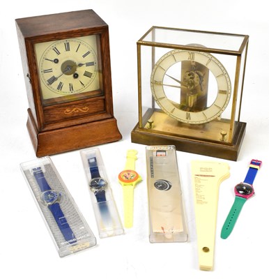 Lot 1492 - An Edwardian inlaid oak American style mantel clock