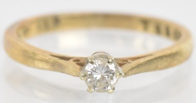Lot 1303 - A 9ct yellow gold single stone diamond...