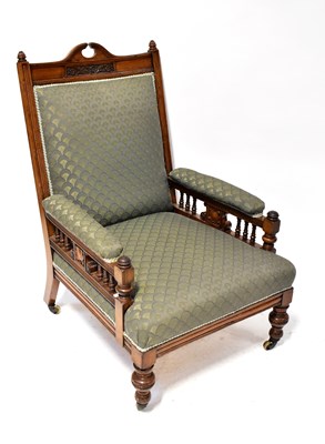 Lot 53 - An Edwardian mahogany low armchair upholstered...