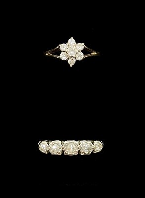 Lot 1215 - An 18ct yellow gold platinum tipped five stone...