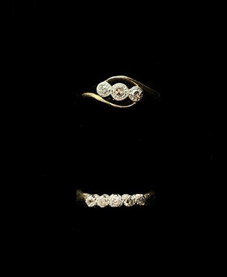 Lot 1216 - An 18ct yellow gold platinum tipped five stone...