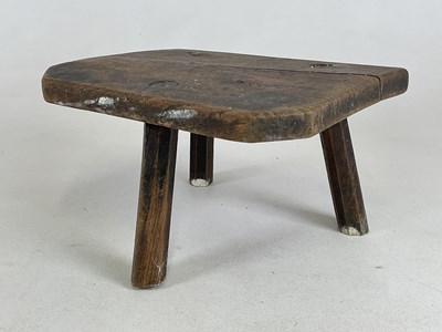 Lot 684 - A 19th century elm seated three legged milking...