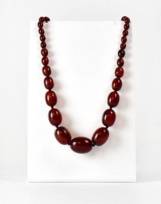 Lot 854 - A cherry Bakelite necklace comprising...