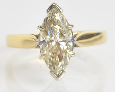 Lot 29 - A yellow metal marquise diamond solitaire ring,...