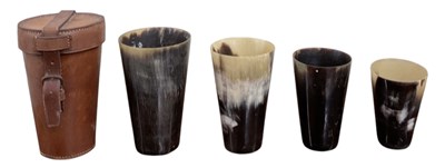 Lot 412 - A graduated set of four horn hunting beakers,...