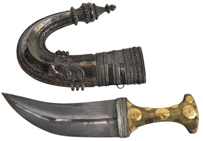 Lot 410 - An Arabian Jambiya dagger, with white metal...