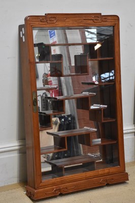 Lot 546 - A reproduction Chinese hardwood mirror back...