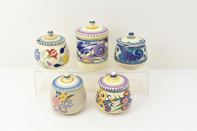 Lot 279 - POOLE POTTERY; five floral preserve or honey...